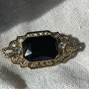 Elegant Black and Gold Brooch